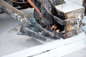 Thermoplastic spray marking machine during road construction. Workers painted white lines on the road surface. (Road Workers Paint) Thailand Asia
