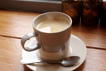 Hot coffee on a wooden table