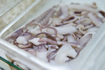 Boiled squid in container 