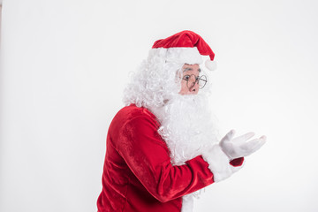 Santa Claus showing empty hand on a white background