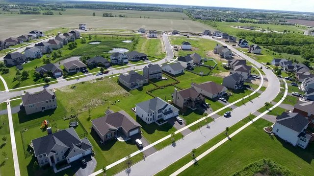 Suburban homes on edge of farmland