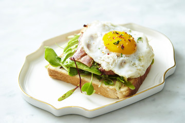 Bacon and avocado toast with fried egg