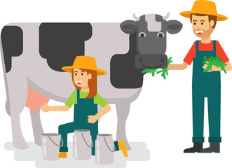 A young female farmer milking the cow 