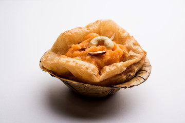 Suji/Sooji Halwa Puri or Shira Poori breakfast, served in a plate and bowl. selective focus