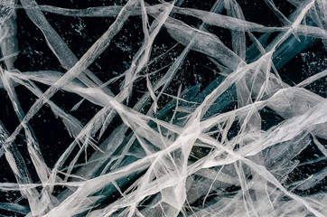 Blue cracked surface of the ice surface