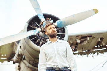 a man on the background of an old plane