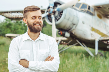 a man on the background of an old plane