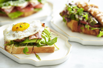 Bacon and avocado toast with croissant sandwich 