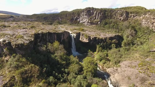 Aerial View Of A Waterfall In The Rio Pita Valley Near Cotopaxi Volcano, Ecuador. It Is Running Off A Cliff Comprised Of An Old Andesitic Lava Flow.