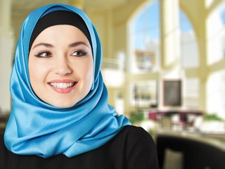 Young arabian woman on light background