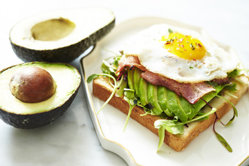 Bacon and avocado toast with fried egg