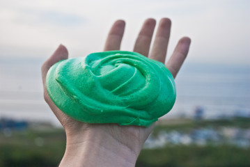 Slime, the child is playing with slime.