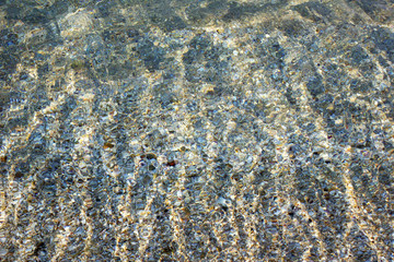 Sea in summer sunny weather. Clear water with the sea on the beach. Wave on the beach on the beach. Crystal clear water in the sea. 