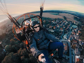 Tuinposter Powered paragliding tandem flight © ArtushFoto