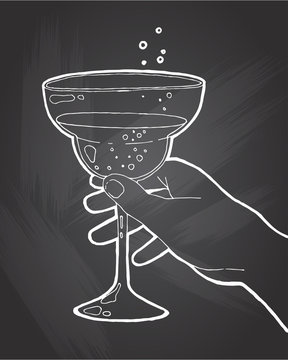 Hand drawn sketch ice alcoholic cocktail in a hand vintage . Vector illustration for coctail menu in chalkboard background. Vector illustration in sketch style.  Hand drawn design element
