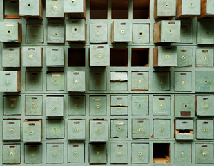 Old green wooden cabinet with drawers