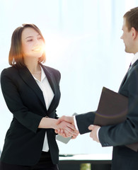 Negotiating business,Image business woman handshake