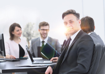 business team with a senior Manager in the foreground