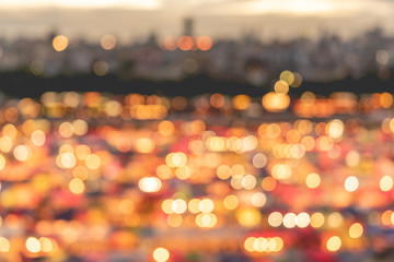 vintage style abstract and bokeh city blur focused or defocused background in train night market ratchada.