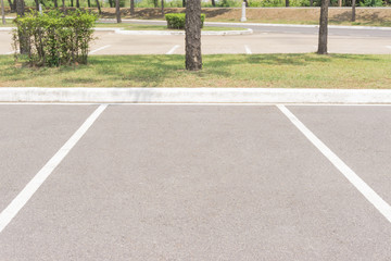 Empty Space in a Parking Lot / Empty space parking lot outdoor in public park. © NOKFreelance