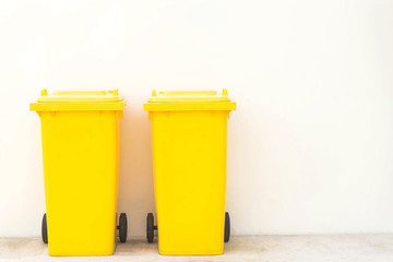 Yellow bins in the park / Wheeled garbage cans on the street.