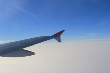 Ailerons and flaps tucked flat in airplane wing at cruise speed