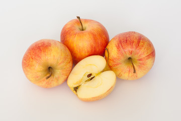 Naklejka na ściany i meble Red and yellow apples on white background. One cut in half. Isolated.