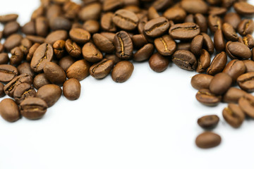Roasted coffee beans on white background.
