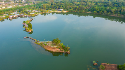 Fototapeta premium aerial top view walking bridge in the river on island in the park