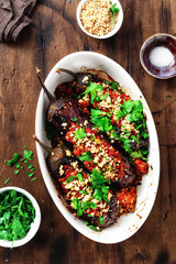 Stuffed eggplants wooden table top view Vegetarian healthy dinner