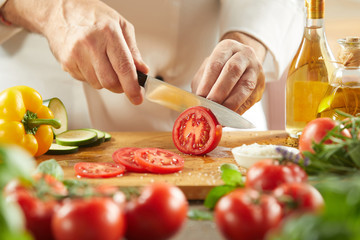 Chef preparing a fresh Italian salad