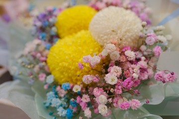 Flower bouquet with colorful Gypsophila and Yellow and white chrysanthemum in full blossom