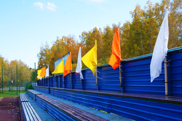 multi-colored flags in the spectator stands