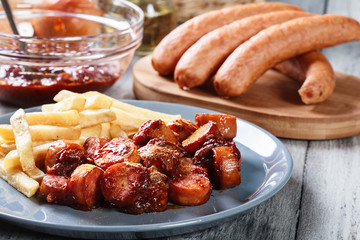 Traditional German currywurst - pieces of sausage with curry sauce