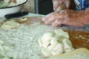 Home-made recipe for dumplings (raviol)i. Traditionally, women of the older generation mold the dumplings in the family.