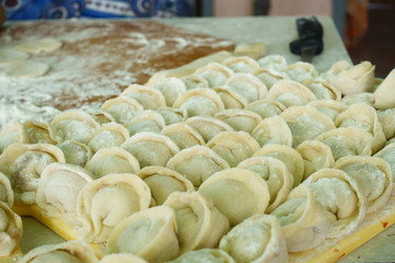 Home-made recipe for dumplings (raviol)i. Traditionally, women of the older generation mold the dumplings in the family.