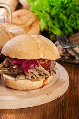 Pulled pork sandwich with red cabbage and bbq sauce