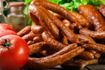 Assorted smoked sausages on a cutting board