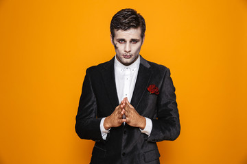 Confident zombie man 20s looking camera isolated