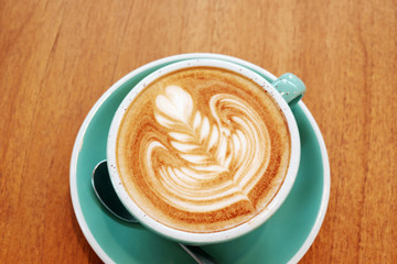 Latte Coffee art on the wooden desk