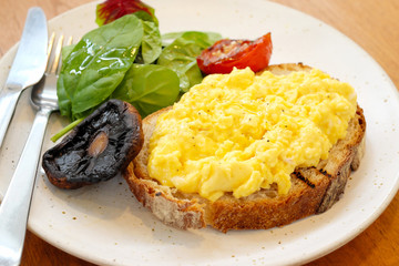 scramble egg on toast with salad.