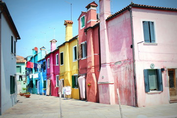 Fototapeta na wymiar Street with colorful buildings in Burano island, Venice, Italy