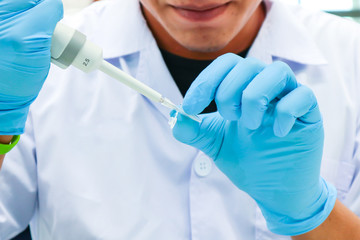Scientist doing research to medical development in the experimental science.