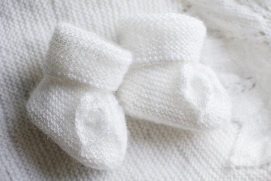 Home knitted baby booties white