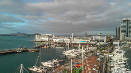 AUCKLAND, NEW ZEALAND - AUGUST 26, 2018: Aerial view of cityscape at sunset. More than 1 million tourists visit Auckland annually