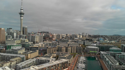 Fototapeta premium AUCKLAND, NEW ZEALAND - AUGUST 26, 2018: Aerial view of cityscape at sunset. More than 1 million tourists visit Auckland annually