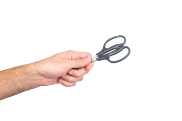 Mans hand with scissors isolated on a white background.