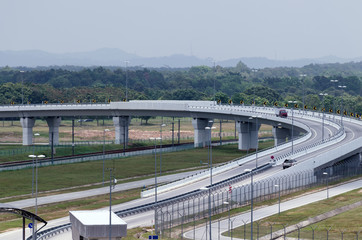Aerial wiew of modern highway and overpass. Concept of unloading of city road network.