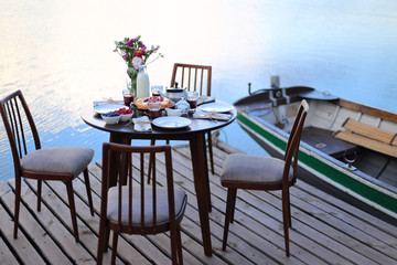 Table served for party dinner on river pier
