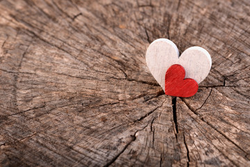 Love Valentine's hearts on rustic wood texture background, copy space.